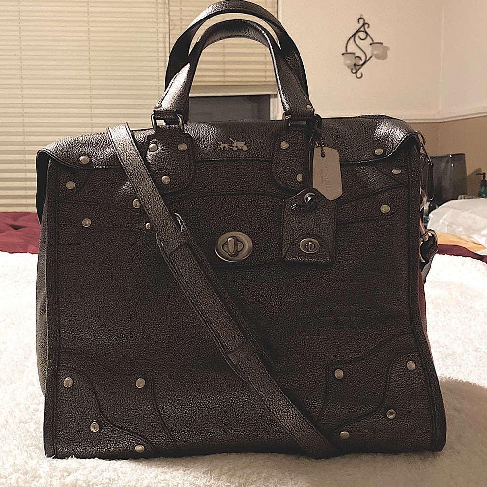 This is a Coach handbag sized medium/large.